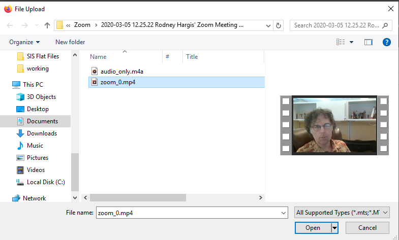 File upload dialog window with "zoom_0.mp4" file selected.